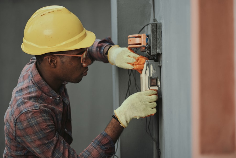Electrician fitting a wall socket