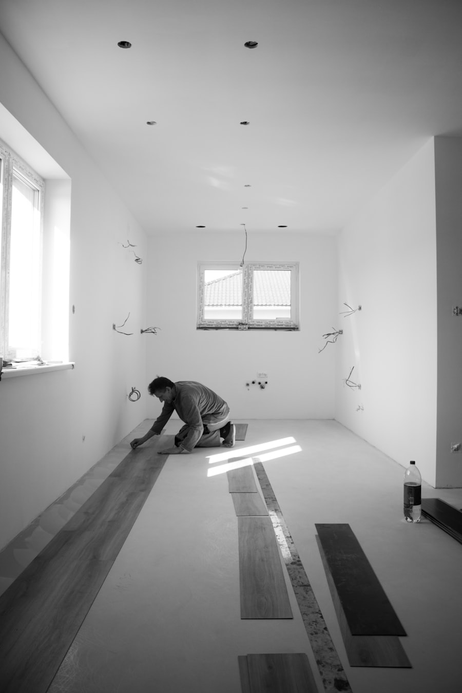 Fitter laying engineered wood flooring planks